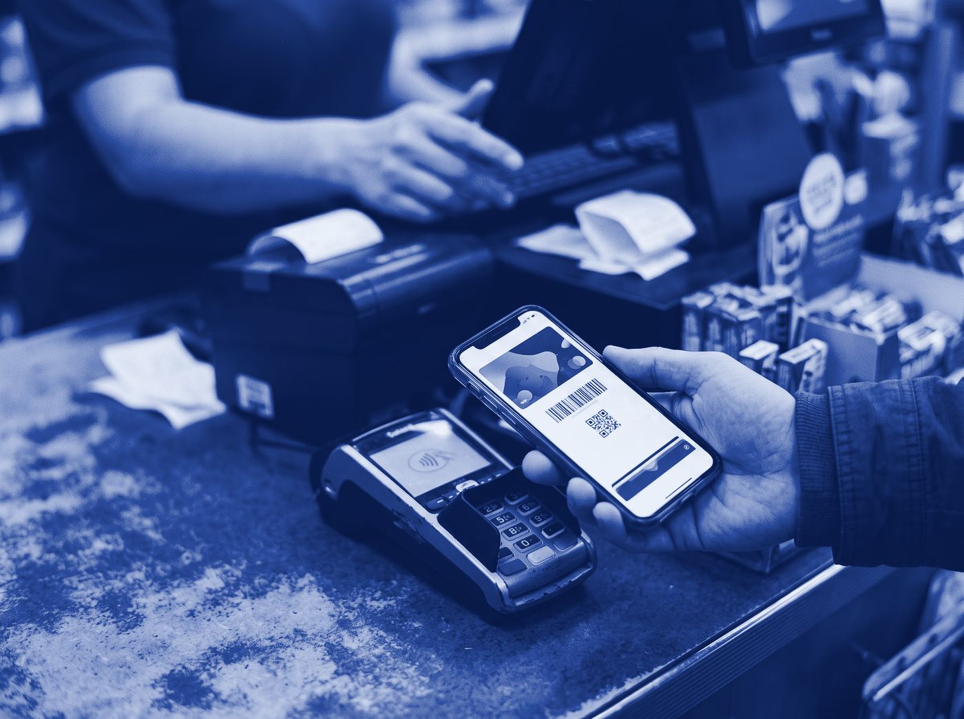 Loyalty card on a phone held near a payment terminal