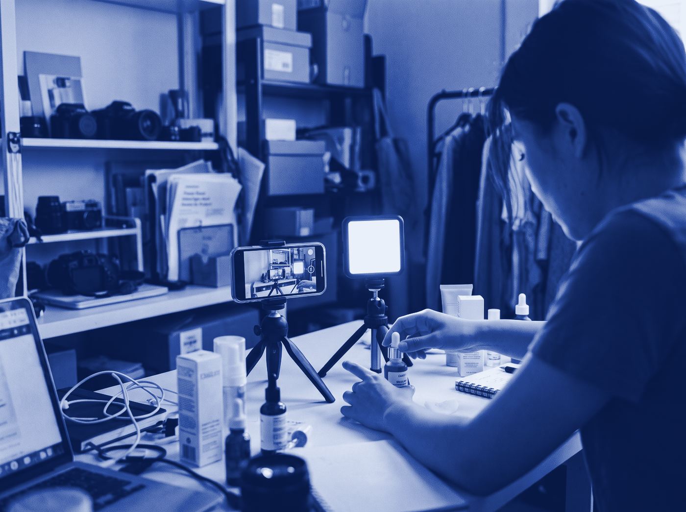 A product being filmed on a phone under a studio light